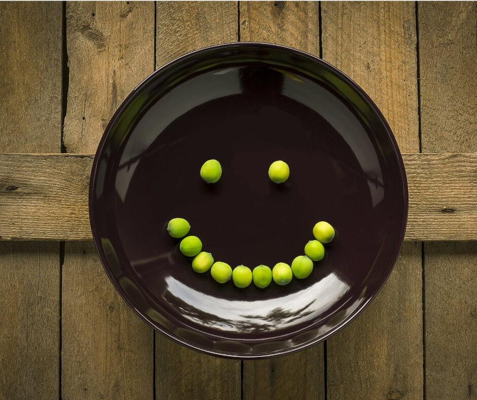 peas in smiley face on plate